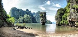 Gay Phuket Island tour destination: James Bond Island, Phang Nga Bay. Tropical beach, limestone cliffs, & lush greenery. Thailand travel.