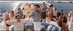 Animated GIF: Party boat scene with diverse group dancing, drinking, and celebrating. Gay travel advice: Enjoying life on the water.