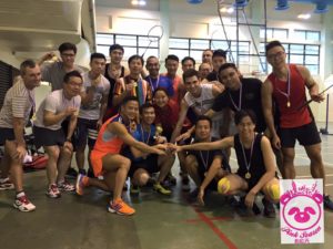 Gay Pride Hong Kong: Group of gay men with medals & trophy at Pink Season event. Badminton rackets visible. Travel advice for LGBT visitors.