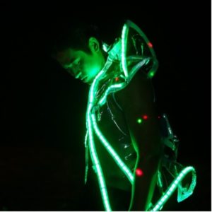 Man in glow-in-the-dark attire at FIN Wonderland, Pattaya. Gay travel nightlife scene. Thailand's vibrant gay scene. LGBTQ+ party experience.