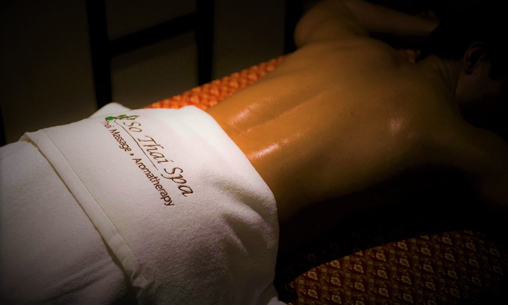 Gay-friendly So Thai Spa massage in Bangkok. Man receiving aromatherapy massage. Relaxing gay travel experience in Thailand.