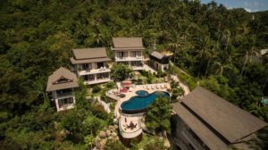 Koh Phangan Pavilions, a gay-friendly hotel. Aerial view of villas and pool surrounded by lush tropical greenery. Ideal for gay travel.