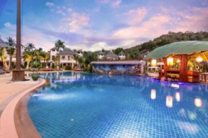 Krabi Resort Pool Villa, a gay-friendly hotel. Features a large pool, swim-up bar, lush greenery, and luxurious villas. Perfect for gay travel.