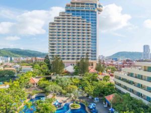 The Royal Paradise Hotel & Spa, a gay-friendly hotel. Features a pool, lush greenery, and views of the city and mountains.