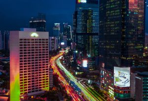 Jakarta at night: Cityscape with skyscrapers and light trails. Best gay travel advice in Jakarta, Indonesia. New update for gay travel.