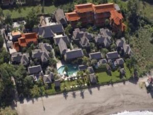Aerial view of Grand Balisani Suites Hotel, a gay-friendly hotel in Bali. Beachfront property with pool and traditional Balinese architecture.