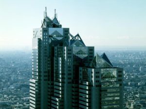 Park Hyatt Tokyo, a gay-friendly & pet-friendly hotel. View of the iconic skyscraper against the Tokyo skyline. Luxury travel for gay men.