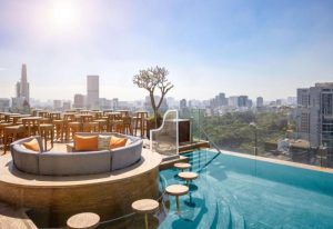 Hôtel des Arts Saigon rooftop pool view. Luxury hotel in Ho Chi Minh City. Number one gay travel destination. MGallery Collection.