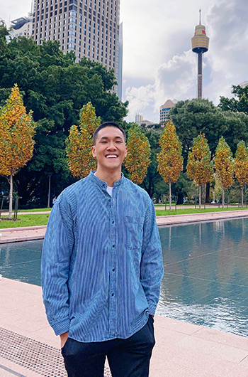 Gay traveler in Hyde Park, Sydney. The Pullman Sydney Hyde Park hotel is a top choice for gay men with its outdoor pool and central location.