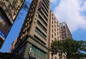 Exterior of Burgary Hotel, a gay-friendly hotel. Tall building with a modern design. Great choice for gay men travel.