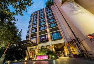 Crowne Plaza Shanghai facade. Gay-friendly hotel in Noah Square, Shanghai. Modern architecture, inviting entrance. Great choice for gay travelers.