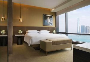 Grand Hyatt Hong Kong gay-friendly hotel room. Modern decor, city view, king bed. Luxury travel for gay men in Hong Kong.
