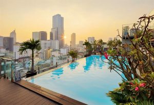 Grand Silverland Hotel's rooftop pool with city view. Gay-friendly hotel in Vietnam for gay men travel, perfect for relaxing vacation.