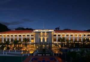 Hotel Fort Canning, a gay-friendly hotel in Singapore. Exterior view of the hotel at night, showcasing its architecture and illuminated facade.