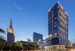 Pan Pacific Yangon, a gay-friendly hotel. Modern skyscraper next to a historic church. A great choice for gay travelers in Yangon.
