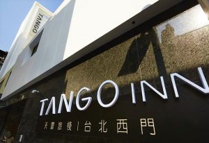 TANGO INN Taipei Ximen facade. Gay-friendly hotel in Taipei, Taiwan. Modern building with the hotel's name in large white letters.