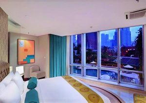 The Grove Suites by GRAND ASTON gay-friendly hotel room. City view, pool, modern design. Ideal for gay travelers seeking luxury & comfort.