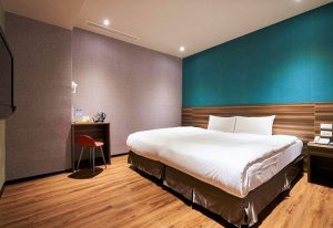 Tomorrow Hotel's gay-friendly room. Modern design, king-size bed, wooden floor, and desk. Ideal for gay men travelers.