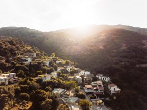 Athens 1890 Hotel & Spa: Gay-friendly Monastery Estate Townhouse. Hillside village view with sunlit mountains. Ideal for gay travel advice.