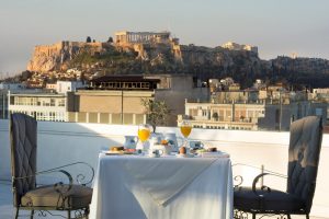 Breakfast with Acropolis view at Gay-Friendly Titania Hotel, Athens. Rooftop dining experience for gay men travelers. Greece vacation.