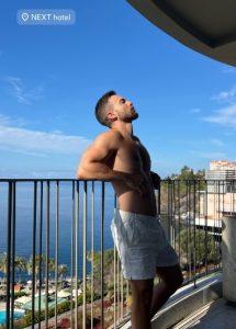 Gay traveler at NEXT Hotel Madeira, Portugal. Man on balcony enjoying the view. Gay travel advice, vacations, and hotel recommendations.