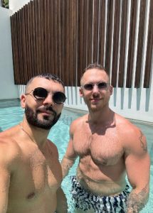 Two gay men in a pool at an adults-only Koh Samui beachfront resort. Number one gay hotel for exploring Koh Samui's gay scene.