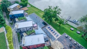 Cross River Kwai gay-friendly hotel aerial view. Unique design, riverside pool, and modern architecture. A perfect gay travel destination.