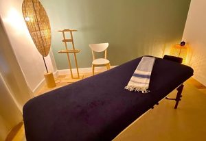 Time for a Break Massage in Paris: Massage table with towel in a serene spa setting. Ideal for gay men's travel and relaxation advice.