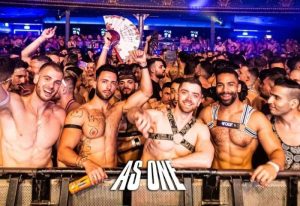 Gay men at As One Easter Weekend Festival. Shirtless crowd, harnesses, fans. Gay travel advice, festival, nightlife.