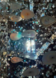 Raffles Istanbul Hotel's luxury interior. Chandelier with discs and cube-shaped crystals. Best luxury gay hotel for gay couples in Istanbul.