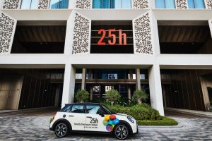 25hours Hotel One Central facade with a branded Mini Cooper. A gay-friendly hotel, offering unique experiences for gay travelers.