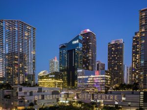 EAST Miami's Brickell City Centre at night. Gay-friendly hotel with modern architecture. Skyscrapers and bright lights define the skyline.