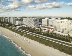 Aerial view of Four Seasons Hotel at The Surf Club, a gay-friendly hotel. Beachfront property with palm trees and ocean views. Miami gay travel.