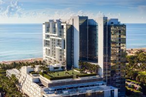 W South Beach, a gay-friendly hotel. Aerial view of the luxury resort with ocean views, palm trees, and modern architecture. Perfect for gay travel.