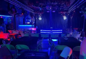 Azucar Nightclub interior, tables, chairs, stage with blue lights, disco ball. Gay bar scene, travel advice. 5-12.jpg