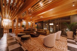 Azure Sky Hotel Adults Only lobby. Gay-friendly hotel lounge area with modern design, wood accents, and comfortable seating. Perfect for gay travelers.