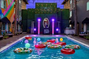 Hotel Ziggy Los Angeles pool view. Gay-friendly hotel with colorful floats, lights, and bar. A vibrant, fun, and welcoming travel spot.