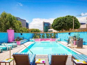 Sofitel Los Angeles at Beverly Hills Hotel pool. Gay-friendly hotel with colorful design, perfect for gay men travel. #gaytravel
