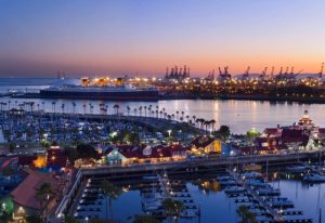 Long Beach at dusk: Hyatt Regency, a most-booked gay hotel, overlooks the harbor, marina, and Queen Mary. A top choice for gay travel.