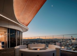 Circa Resort and Casino adults-only rooftop lounge at night. Gay-friendly hotel with fire pit, seating, and Las Vegas skyline views.