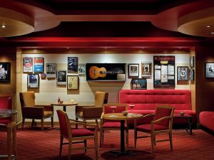 Chelsea Hotel Toronto's gay-friendly lounge area. It features cozy seating, warm lighting, and music-themed decor. Ideal for gay travelers.