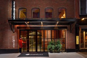 Hotel Indigo Lower East Side entrance. Gay-friendly hotel with brick facade, industrial-chic design. Welcoming for LGBTQ+ travelers.