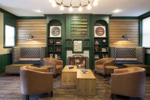 Majestic Hotel Chicago's gay-friendly lounge. Leather chairs, fireplace, and baseball decor create a cozy, inviting space.