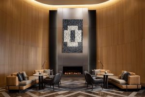 Park Hyatt Toronto's stylish lounge with a fireplace. A gay-friendly hotel offering luxury accommodations and a welcoming atmosphere.