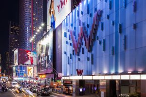 W New York - Times Square Hotel facade at night. Gay-friendly hotel in NYC with modern design and vibrant city views.