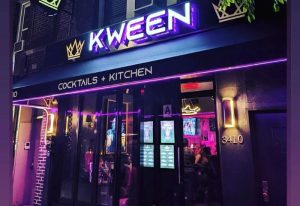Kween Cocktails + Kitchen in Montreal. Exterior view of the gay-friendly bar with neon lights and a modern design. Travel advice.