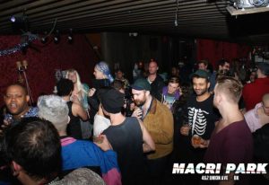 Crowded Macri Park gay video bar in New York. Gay nightlife scene, with men socializing and dancing. Popular gay travel destination.