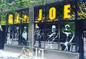 Sauna G.I. Joe in Montreal. Exterior view of the gay bathhouse, with window displays of muscular men. Gay travel advice.