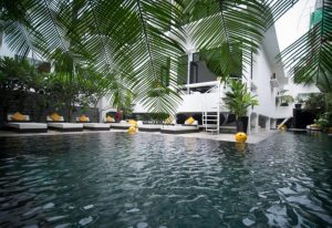 Arthur & Paul men-only hotel pool in Phnom Penh. Gay saunas, sunbeds, and tropical plants surround the pool at this gay-friendly hotel.