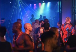 Gay nightlife at Beefcakes gay bar in Puerto Vallarta. Men gather under laser lights to dance and socialize at this popular gay travel destination.